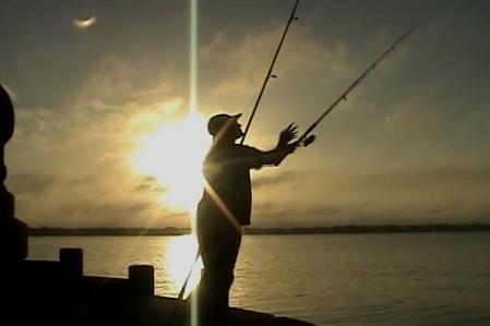 Colin-Fishing-Sun-Casting Fishing in Tampa Bay at sun-rise.