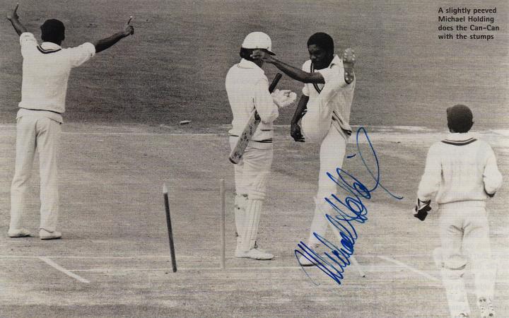 MICHAEL HOLDING autograph Signed west indies cricket memorabilia Jamaica magazine picture of him in action - doing the stump-kicking Can-Can - against England